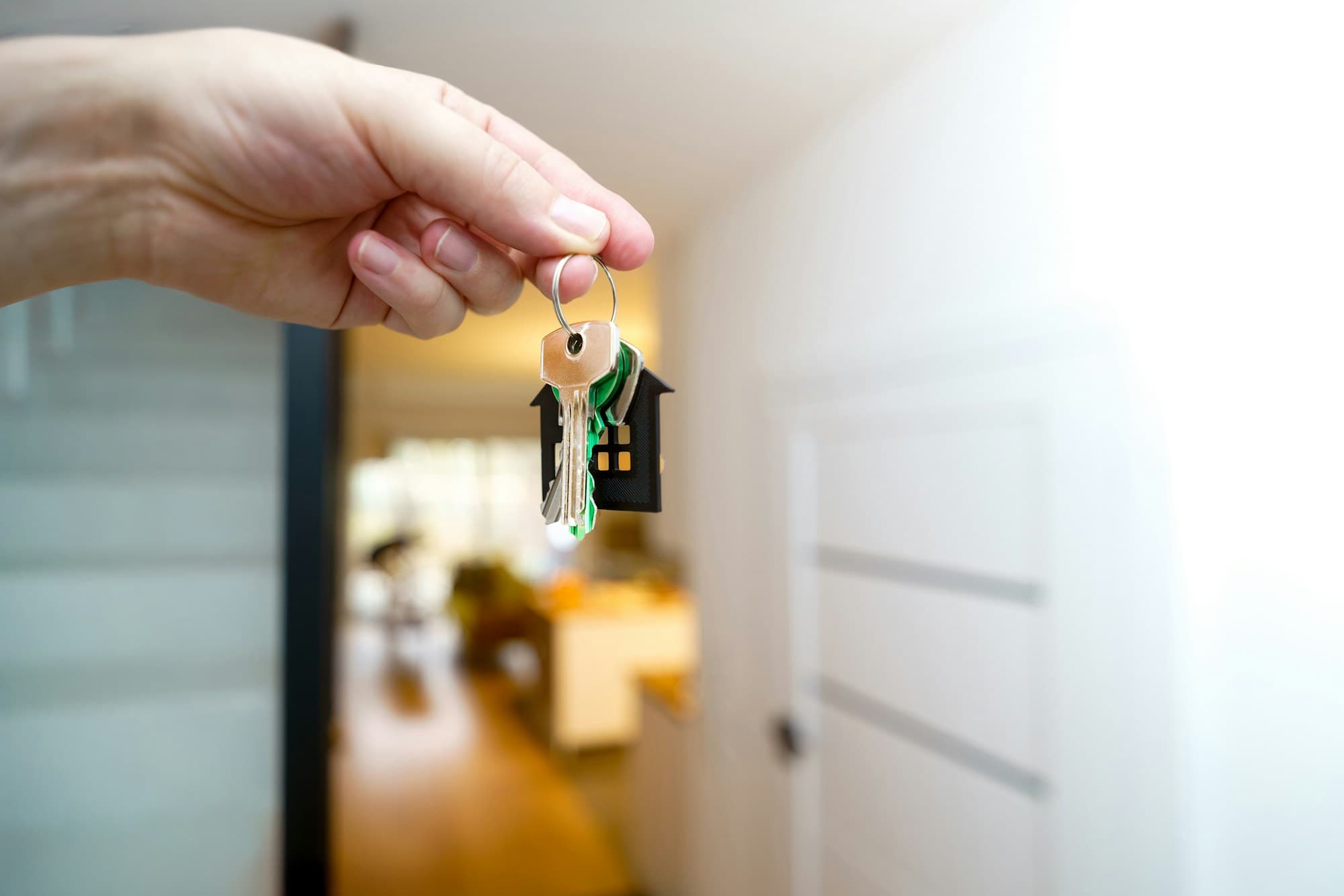 New homeowner receiving the keys to their apartment on handover day